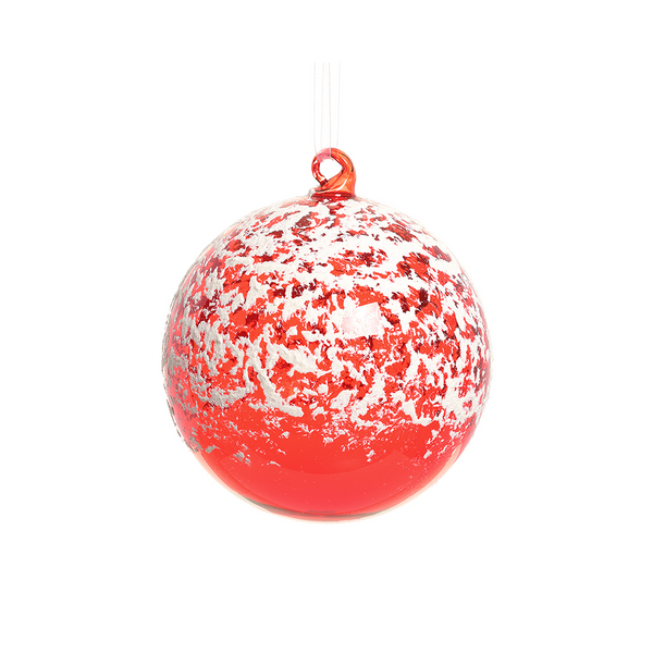 Boule de verre rouge enneigée